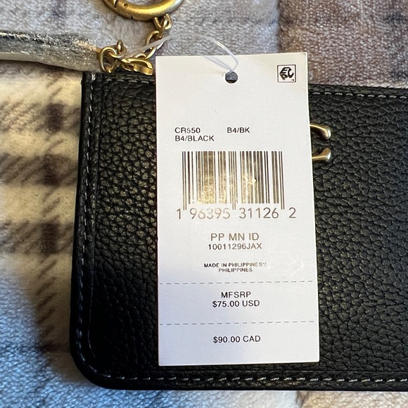 This is a Coach Mini Skinny ID Case in black polished pebble leather. - Picture 5 of 7